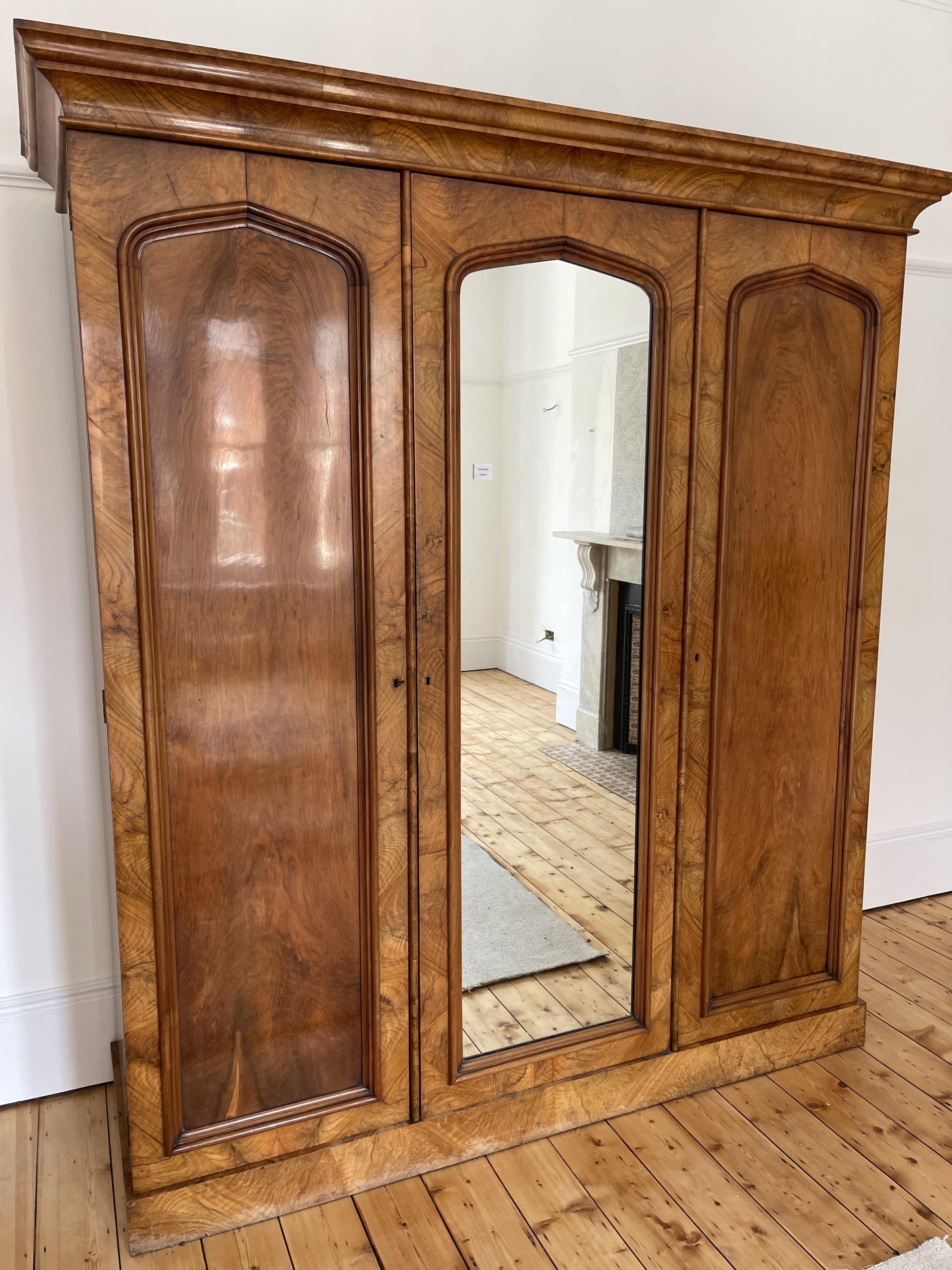 A Victorian walnut triple compactum wardrobe, width 201cm, depth 66cm, height 222cm. Condition - good